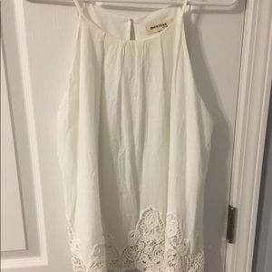 White tank top with detailing on bottom